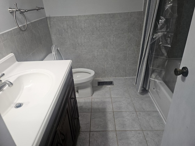 1182 Middlebury Ln Unit D1, Wheeling, IL 60090 - full bathroom featuring tile walls, vanity, toilet, shower / bath combination with curtain, and tile patterned floors