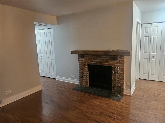 1182 Middlebury Ln Unit D1, Wheeling, IL 60090 - unfurnished living room with baseboards, wood finished floors, and a fireplace