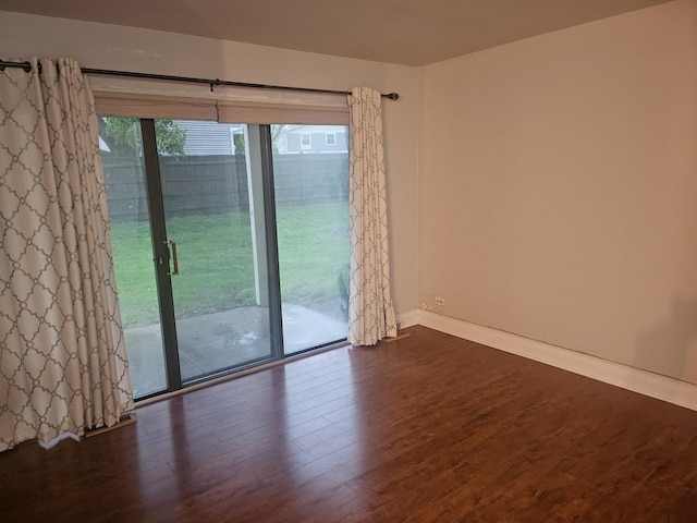 1182 Middlebury Ln Unit D1, Wheeling, IL 60090 - empty room with dark wood finished floors and baseboards