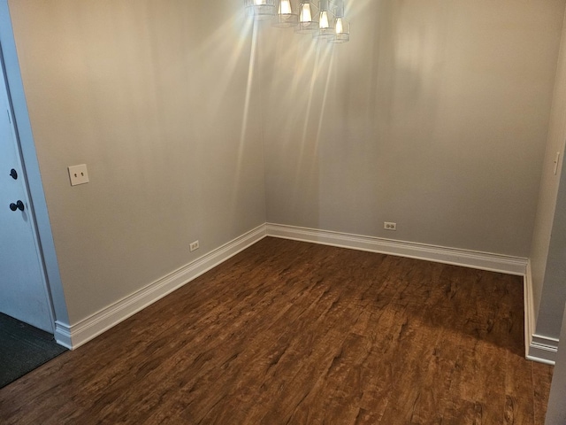 1182 Middlebury Ln Unit D1, Wheeling, IL 60090 - unfurnished room featuring dark wood-style floors and baseboards