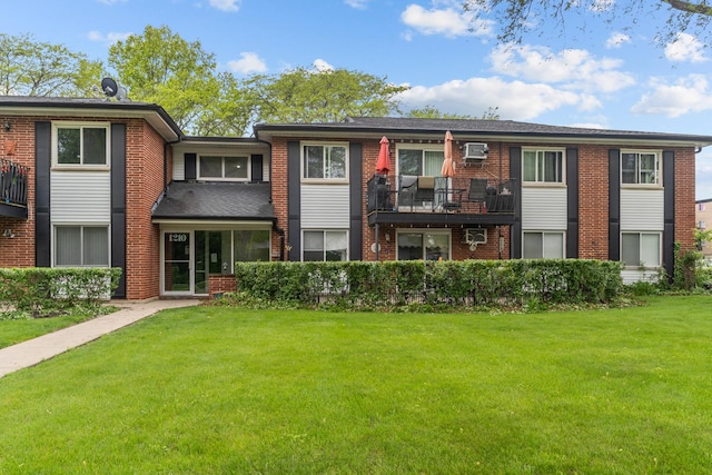 1210 N Dale Ave Unit 2I, Arlington Heights, IL 60004 - view of front of house with a front yard and brick siding