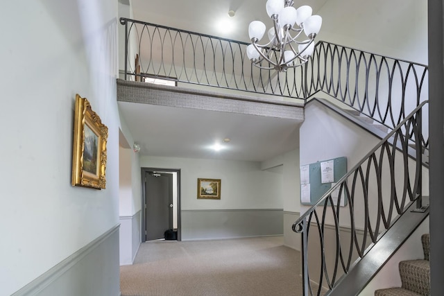 1210 N Dale Ave Unit 2I, Arlington Heights, IL 60004 - stairway with carpet and a chandelier
