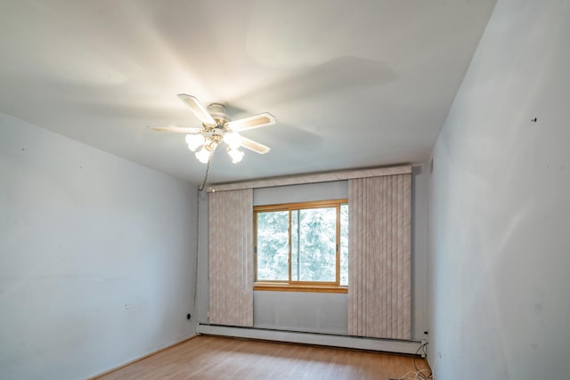 1210 N Dale Ave Unit 2I, Arlington Heights, IL 60004 - unfurnished room featuring a baseboard heating unit, a ceiling fan, and light wood finished floors