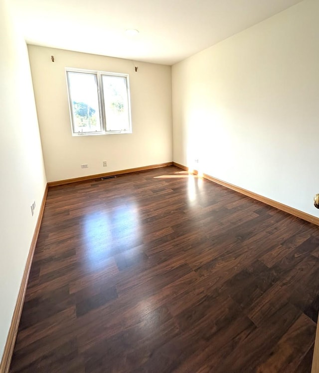 3383 S Archer Ave, Chicago, IL 60608 - spare room with dark wood-style floors and baseboards