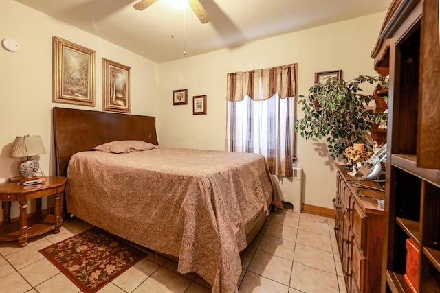 605 E St, Mazon, IL 60444 - bedroom with radiator heating unit, light tile patterned floors, and ceiling fan