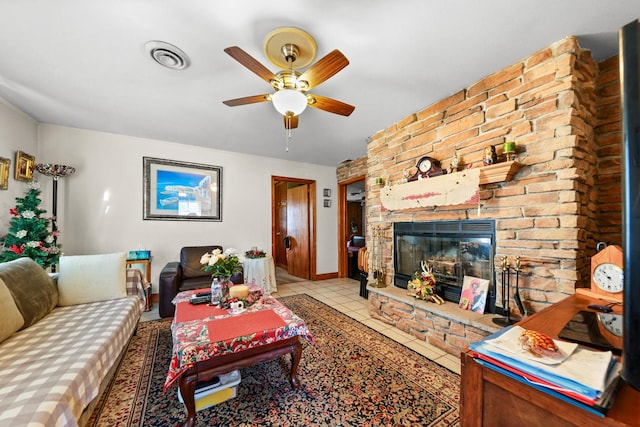 605 E St, Mazon, IL 60444 - living area with ceiling fan, a fireplace, tile patterned flooring, and baseboards