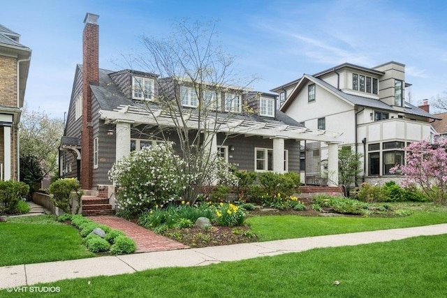 2400 Park Pl, Evanston, IL 60201 - view of front of property featuring a chimney and a front yard