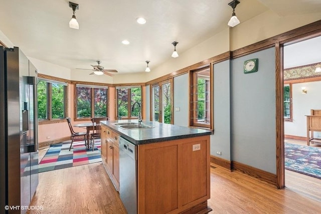 2400 Park Pl, Evanston, IL 60201 - kitchen with stainless steel fridge, a sink, dishwashing machine, light wood-style flooring, and recessed lighting