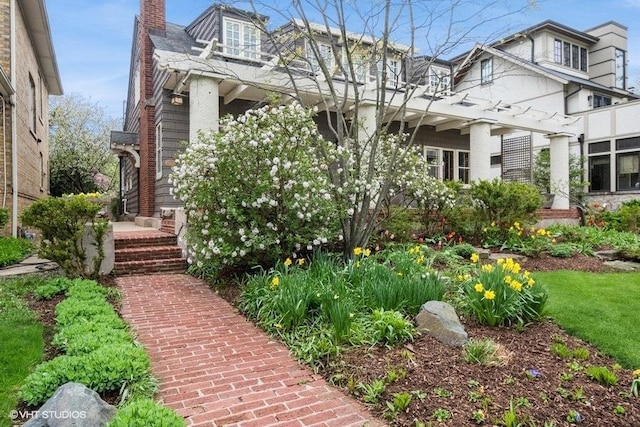 2400 Park Pl, Evanston, IL 60201 - view of front of property with a chimney and stucco siding