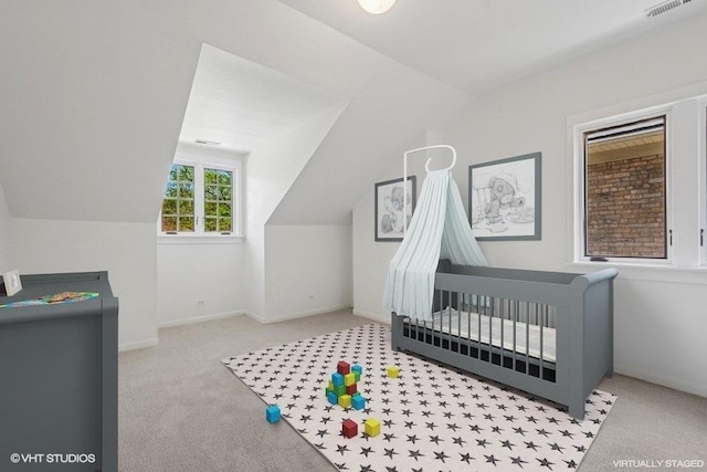2400 Park Pl, Evanston, IL 60201 - unfurnished bedroom featuring carpet, a crib, vaulted ceiling, and baseboards
