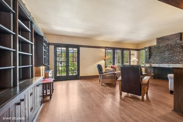 2400 Park Pl, Evanston, IL 60201 - sitting room featuring wood finished floors, baseboards, and french doors