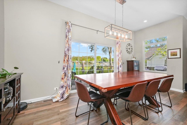 2215 N Woodlawn Park Ave, Mchenry, IL 60051 - dining space with wood finished floors, a chandelier, baseboards, and recessed lighting