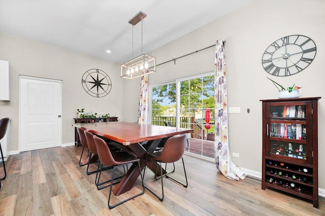 2215 N Woodlawn Park Ave, Mchenry, IL 60051 - dining area with light wood-type flooring, a chandelier, baseboards, and recessed lighting