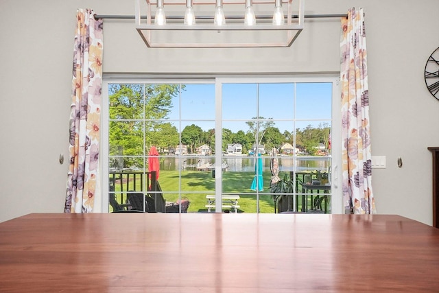 2215 N Woodlawn Park Ave, Mchenry, IL 60051 - unfurnished dining area with healthy amount of natural light and a water view
