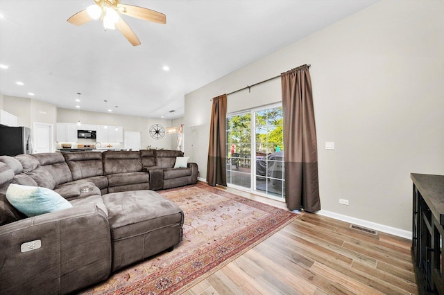 2215 N Woodlawn Park Ave, Mchenry, IL 60051 - living area with light wood finished floors, baseboards, a ceiling fan, and recessed lighting