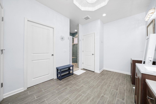 2215 N Woodlawn Park Ave, Mchenry, IL 60051 - full bath featuring a shower stall, vanity, wood finished floors, baseboards, and recessed lighting