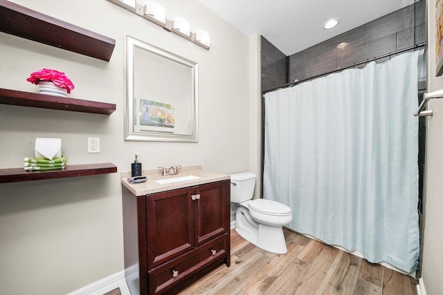 2215 N Woodlawn Park Ave, Mchenry, IL 60051 - bathroom with toilet, wood finished floors, vanity, a shower with shower curtain, and recessed lighting