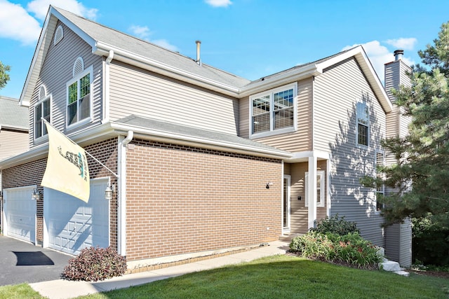 1370 Grandview Ct, Algonquin, IL 60102 - view of front facade featuring brick siding, driveway, and an attached garage