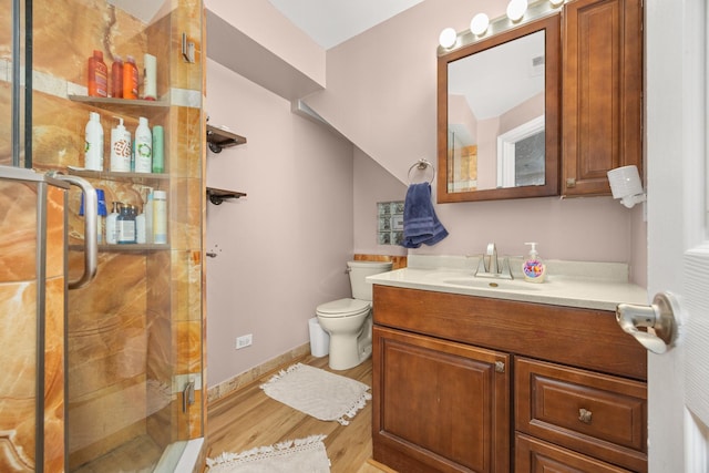 11030 S Nagle Ave, Worth, IL 60482 - full bathroom with vanity, wood finished floors, a shower stall, toilet, and baseboards