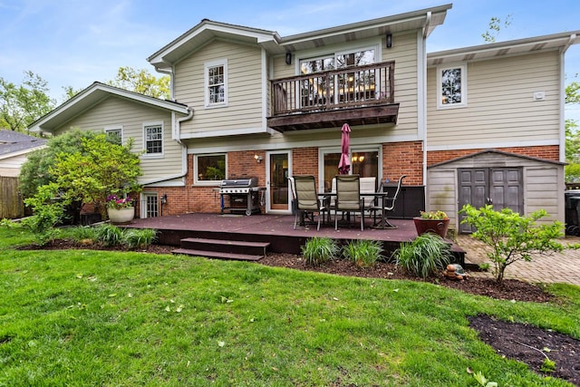1101 Juniper Ter, Glenview, IL 60025 - rear view of house with a balcony, brick siding, a lawn, outdoor dining space, and a wooden deck