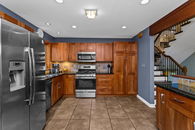 1101 Juniper Ter, Glenview, IL 60025 - kitchen featuring stainless steel appliances, tasteful backsplash, brown cabinets, tile patterned floors, and recessed lighting