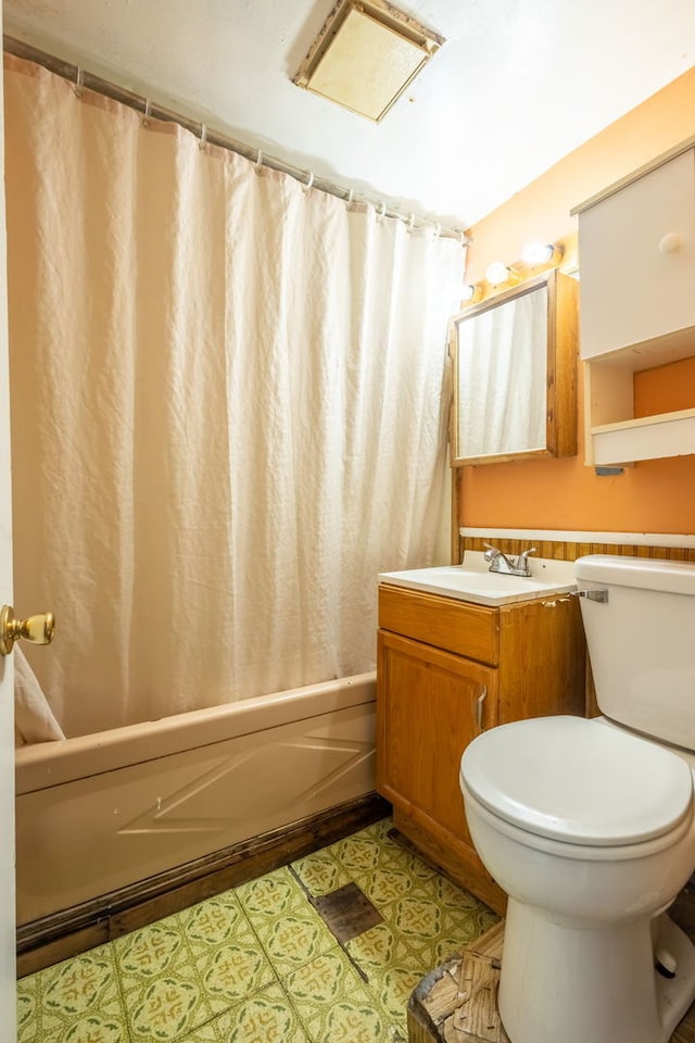 5648 S California Ave, Chicago, IL 60629 - full bath with vanity, toilet, shower / bath combo with shower curtain, and tile patterned floors