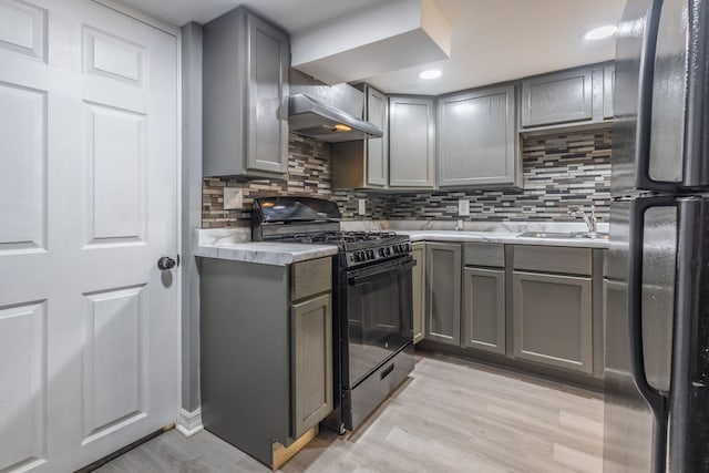 5648 S California Ave, Chicago, IL 60629 - kitchen featuring black appliances, gray cabinetry, wall chimney range hood, tasteful backsplash, and recessed lighting