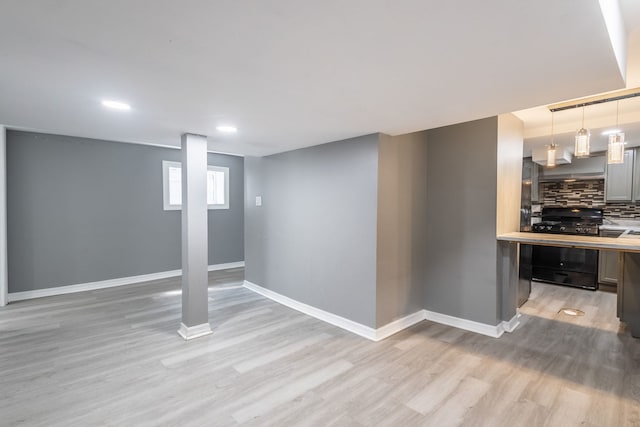 5648 S California Ave, Chicago, IL 60629 - basement featuring light wood-style floors, baseboards, and recessed lighting