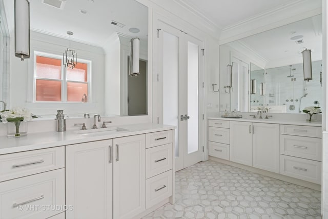 1963 N Dayton St, Chicago, IL 60614 - bathroom featuring ornamental molding, two vanities, and a stall shower