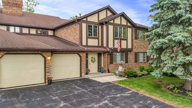13253 S Oak Ridge Trl Unit 2B, Palos Heights, IL 60463 - english style home with driveway, brick siding, stucco siding, a shingled roof, and a garage