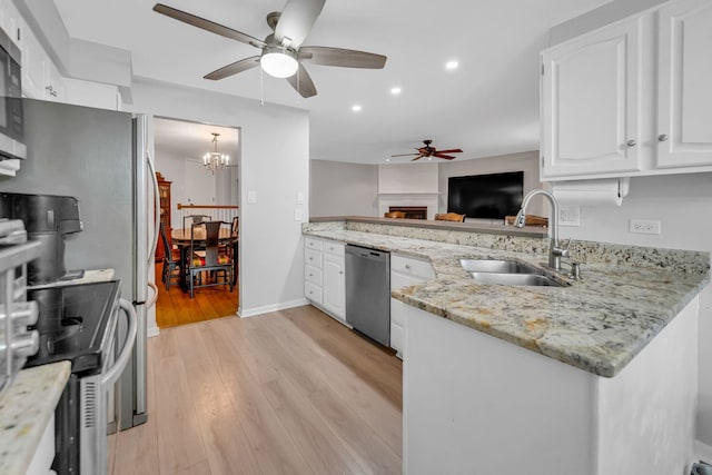 13253 S Oak Ridge Trl Unit 2B, Palos Heights, IL 60463 - kitchen with appliances with stainless steel finishes, ceiling fan, a sink, recessed lighting, and white cabinetry