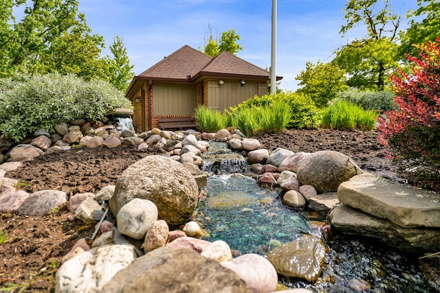 13253 S Oak Ridge Trl Unit 2B, Palos Heights, IL 60463 - view of property exterior with a garden pond