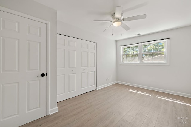 1206 Spur Ct Unit 1206, Wheeling, IL 60090 - unfurnished bedroom featuring light wood finished floors, a closet, baseboards, and a ceiling fan