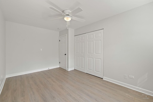 1206 Spur Ct Unit 1206, Wheeling, IL 60090 - unfurnished bedroom featuring wood finished floors, baseboards, a closet, and a ceiling fan