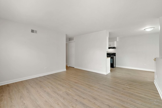 1206 Spur Ct Unit 1206, Wheeling, IL 60090 - unfurnished room featuring light wood finished floors and baseboards
