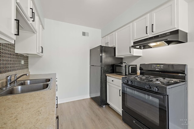 1206 Spur Ct Unit 1206, Wheeling, IL 60090 - kitchen featuring black appliances, under cabinet range hood, a sink, white cabinetry, and decorative backsplash