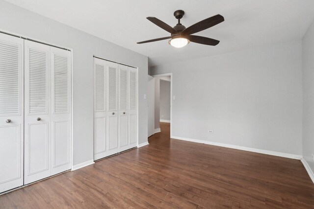 2311 183rd St Unit 203, Homewood, IL 60430 - unfurnished bedroom featuring two closets, wood finished floors, and a ceiling fan