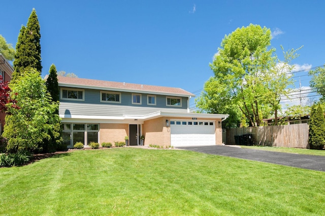 9140 Keystone Ave, Skokie, IL 60076 - view of front facade with driveway and an attached garage