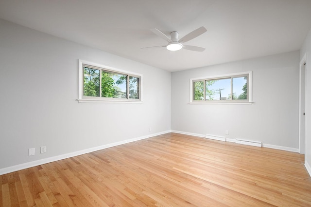 9140 Keystone Ave, Skokie, IL 60076 - empty room with a baseboard heating unit, a ceiling fan, and baseboards