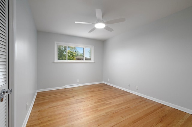 9140 Keystone Ave, Skokie, IL 60076 - unfurnished room featuring a ceiling fan, light wood-style floors, baseboard heating, and baseboards
