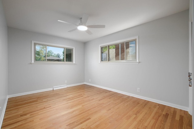 9140 Keystone Ave, Skokie, IL 60076 - empty room with plenty of natural light, a baseboard radiator, light wood finished floors, and ceiling fan