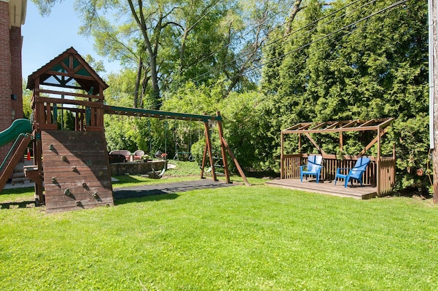 9140 Keystone Ave, Skokie, IL 60076 - view of grassy yard with a playground and a wooden deck