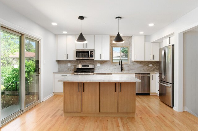 9140 Keystone Ave, Skokie, IL 60076 - kitchen featuring appliances with stainless steel finishes, a sink, healthy amount of natural light, light wood finished floors, and recessed lighting