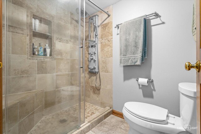 312 Dunham Place Commons Unit 312, Saint Charles, IL 60174 - bathroom with toilet, a stall shower, and tile patterned floors