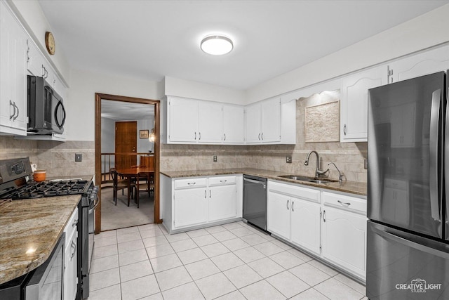 312 Dunham Place Commons Unit 312, Saint Charles, IL 60174 - kitchen with stainless steel appliances, a sink, decorative backsplash, and light stone counters