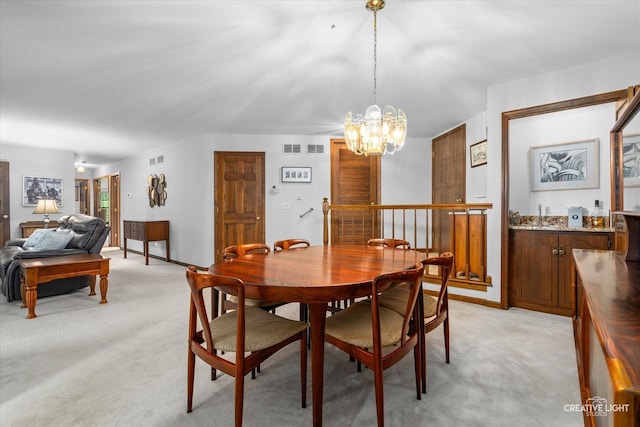 312 Dunham Place Commons Unit 312, Saint Charles, IL 60174 - dining area featuring light carpet and a chandelier