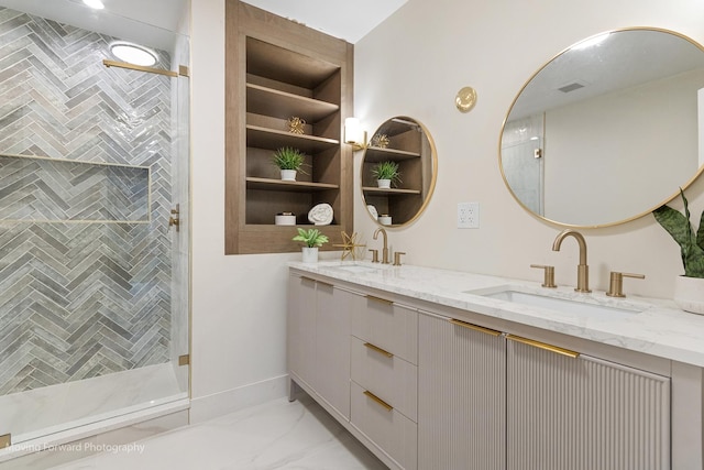 611 S Fern Ave, Elmhurst, IL 60126 - bathroom featuring double vanity, a shower stall, and marble finish flooring