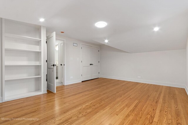 611 S Fern Ave, Elmhurst, IL 60126 - additional living space with baseboards, light wood-style floors, recessed lighting, and built in shelves