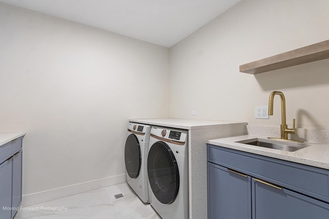 611 S Fern Ave, Elmhurst, IL 60126 - laundry room with washer and clothes dryer, baseboards, light marble finish floors, and cabinet space