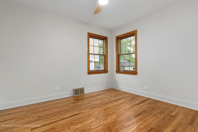 611 S Fern Ave, Elmhurst, IL 60126 - empty room featuring light wood-type flooring, a ceiling fan, and baseboards